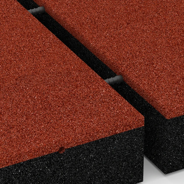 Großaufnahme vom Verbindungssystem von WARCO-Boden 6278 - Fallskyddsplatta – 300 cm im Farbdesign Tegelröd. Abmessungen 50 x 50 x 11 cm.